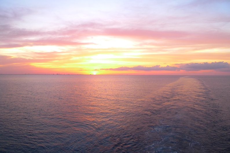 The sun was setting right on top of Florida as we sailed off to The Bahamas.